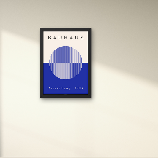 Bauhaus exhibition poster in blue and white with an abstract circle design, framed for contemporary wall decoration.



