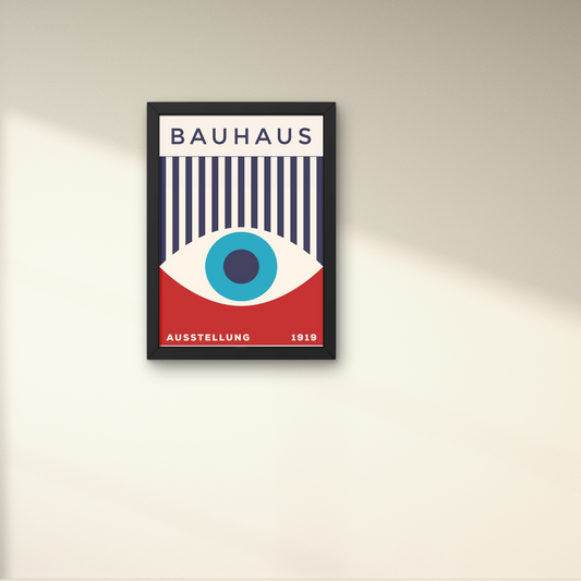 Bauhaus poster with bold eye and striped design in red, blue, and white, framed for an artistic wall accent.



