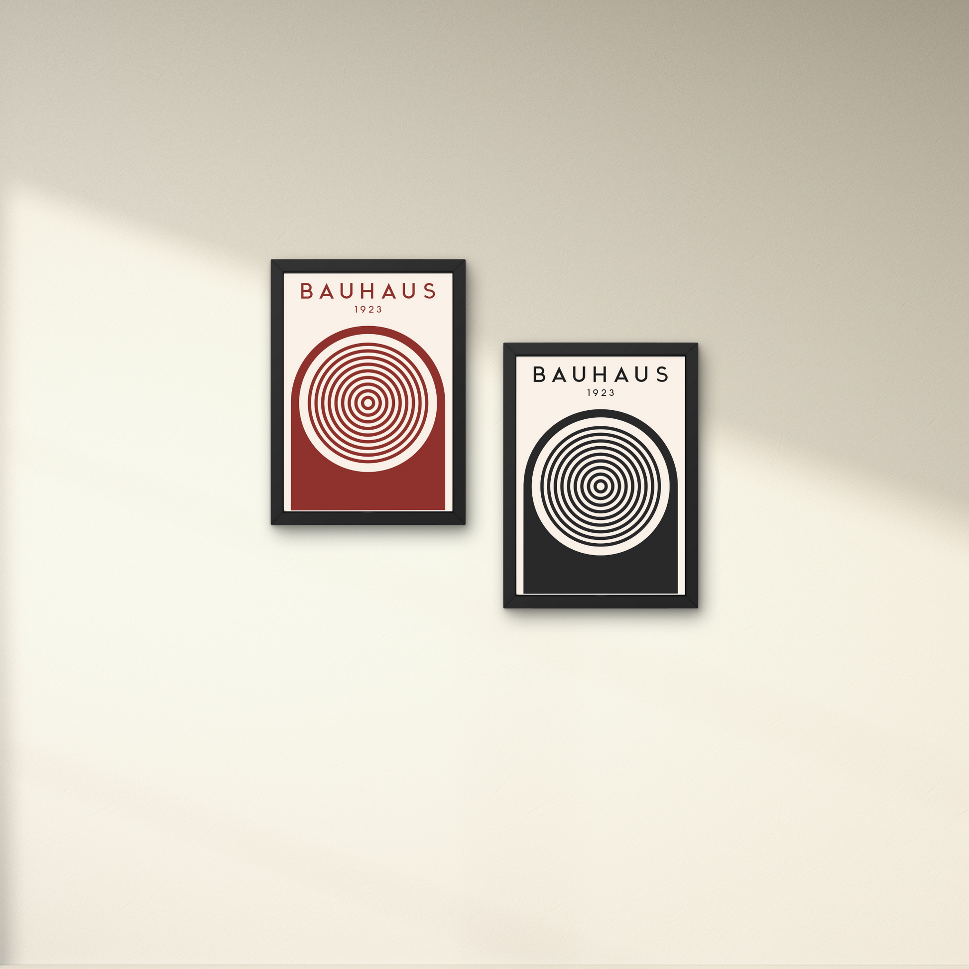 Pair of minimalist Bauhaus posters in black and red, featuring concentric circles for a striking wall art statement



