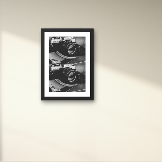 Vintage-inspired framed wall art of a classic camera, evoking nostalgic reflections.



