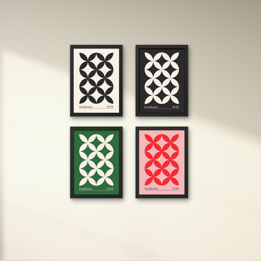 Set of four Bauhaus-inspired abstract geometric posters in black, white, green, and red, framed for modern wall decor.




