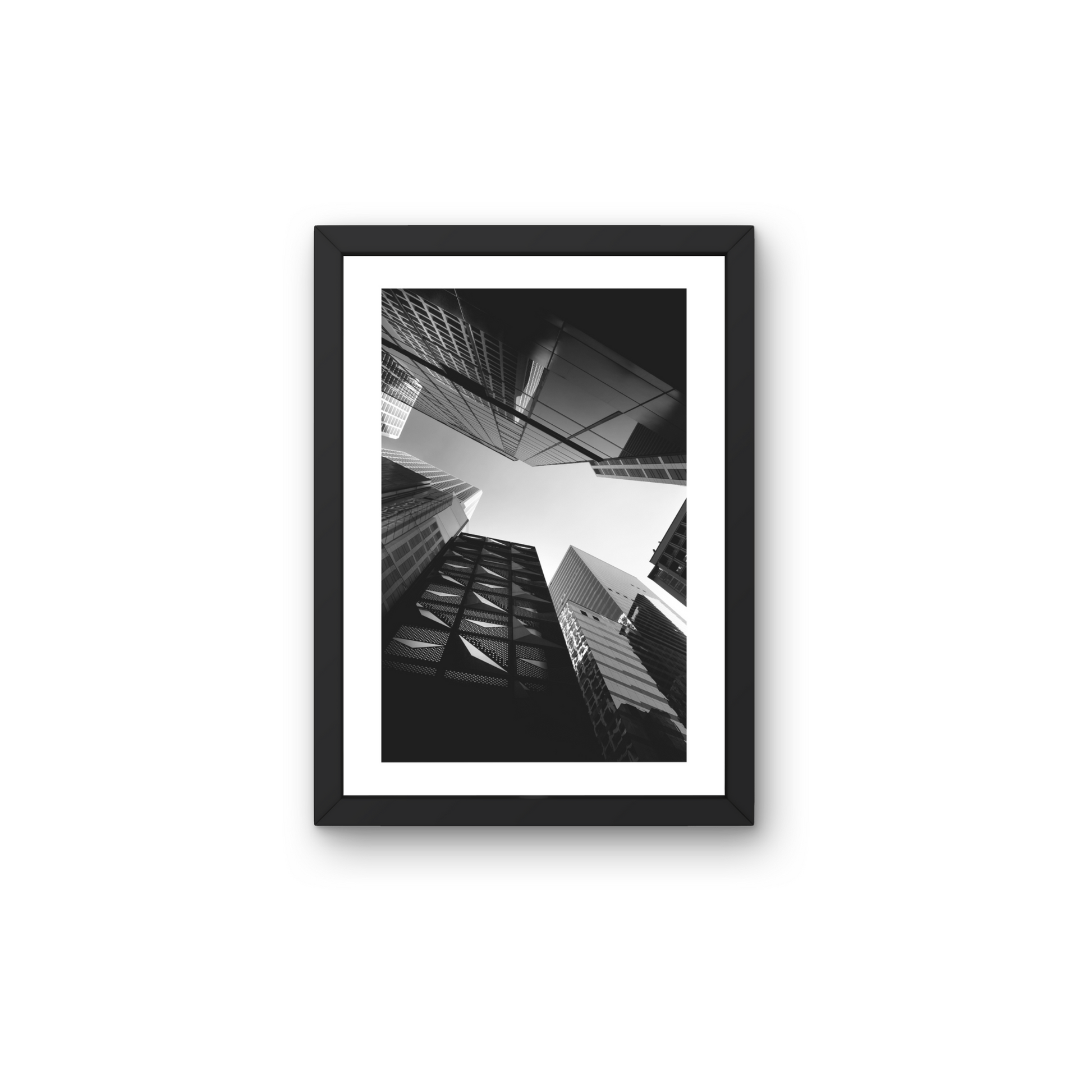 Framed modern wall art featuring a cityscape tapestry in black and white.



