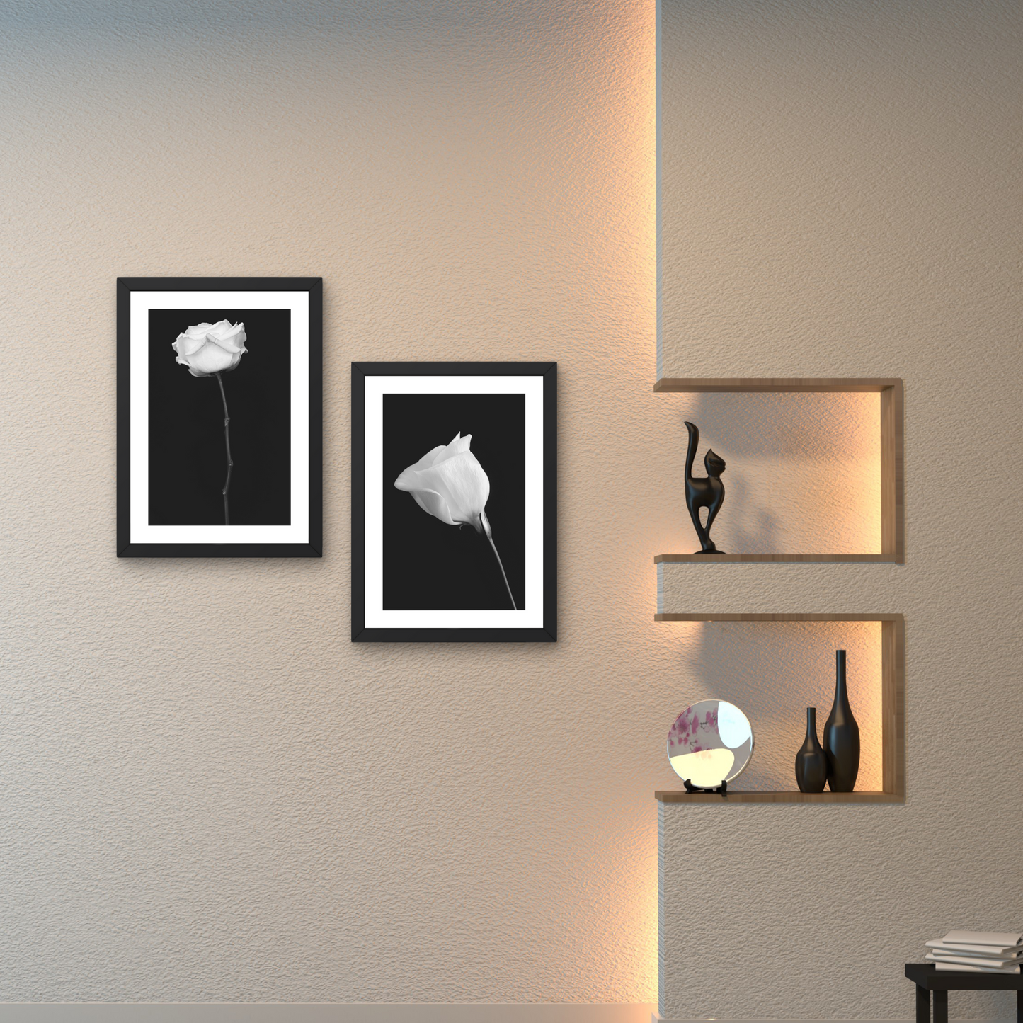 Pair of minimalist floral art pieces featuring delicate white flowers on a black background.



