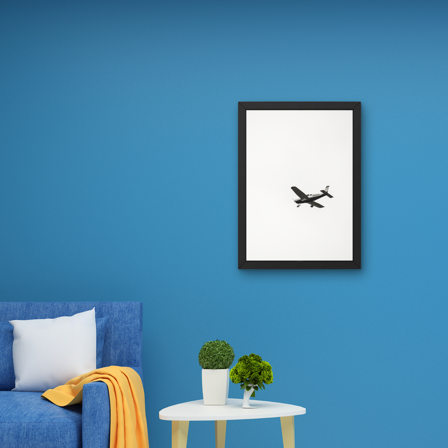 Minimalist wall art featuring an airplane in mid-air against a white background."




