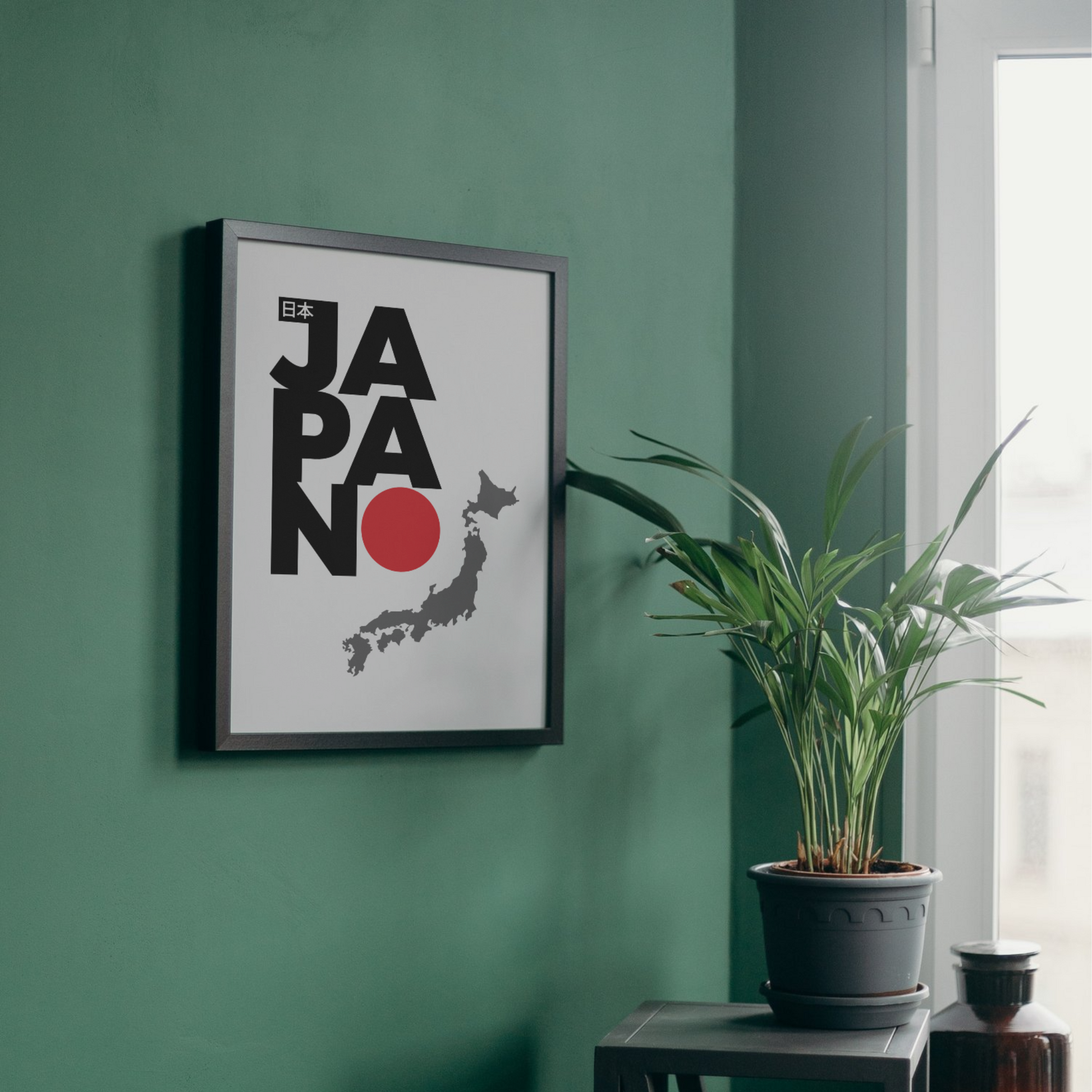 Framed minimalist wall art featuring 'Japan' text with the country's map and red circle symbol, perfect for modern wall decor or travel-themed designs, from The Modern Curated Creations.