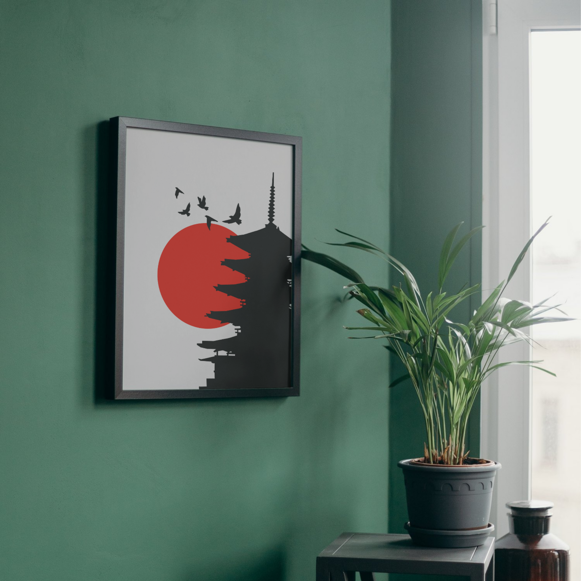 Framed wall art of a Japanese pagoda silhouette with a red sun in the background, perfect for modern decor, from The Modern Curated Creations.